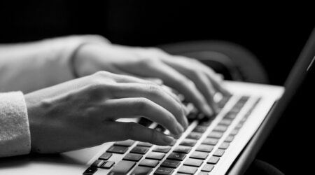 Woman's hands at keyboard for the WordPress Accessibility Day 2024