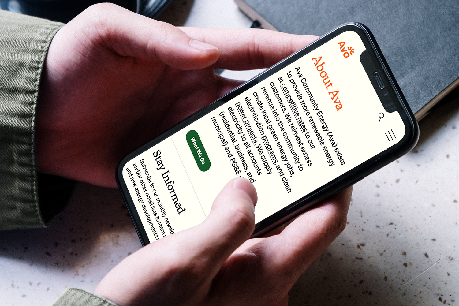 Ava Community Energy website on an iPhone